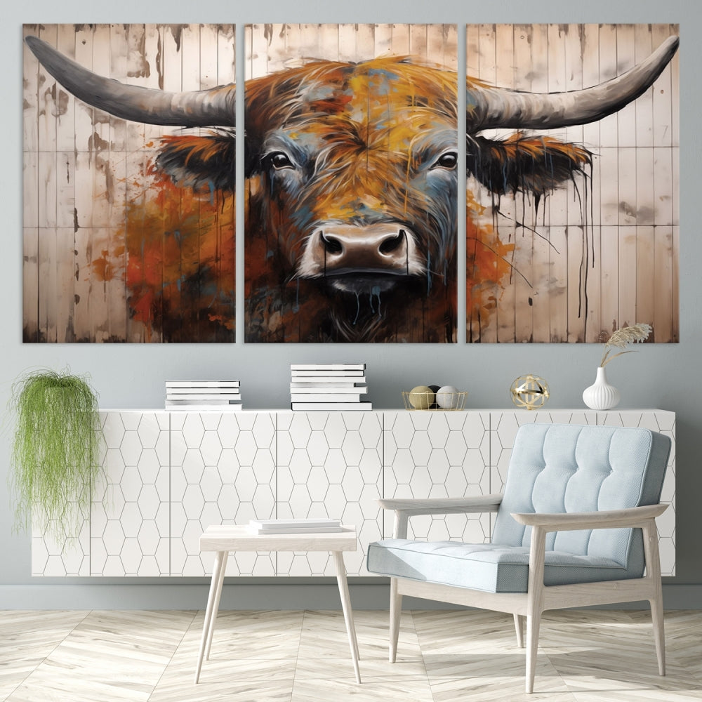 A triptych featuring the Scottish Highland Cow Cattle Art Print on a wood-style background adorns the wall, imparting rustic elegance to the room decor.