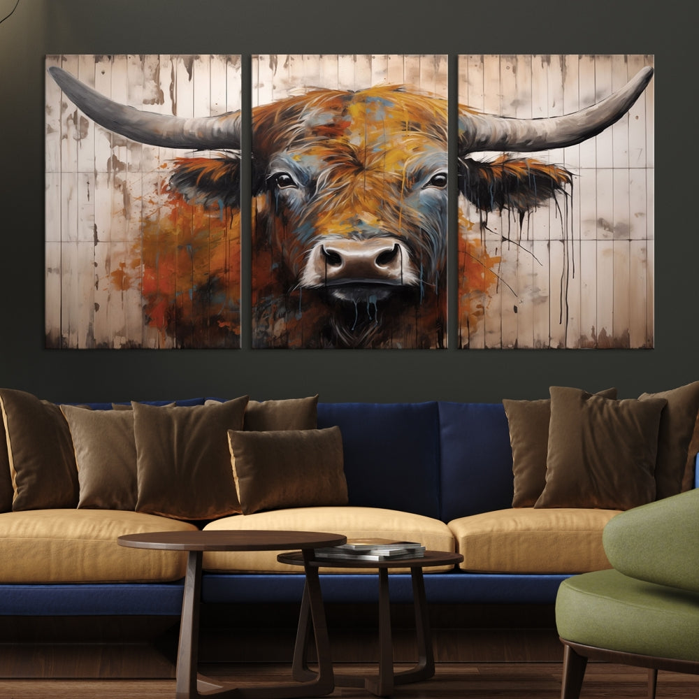 A triptych featuring the Scottish Highland Cow Cattle Art Print on a wood-style background adorns the wall, imparting rustic elegance to the room decor.