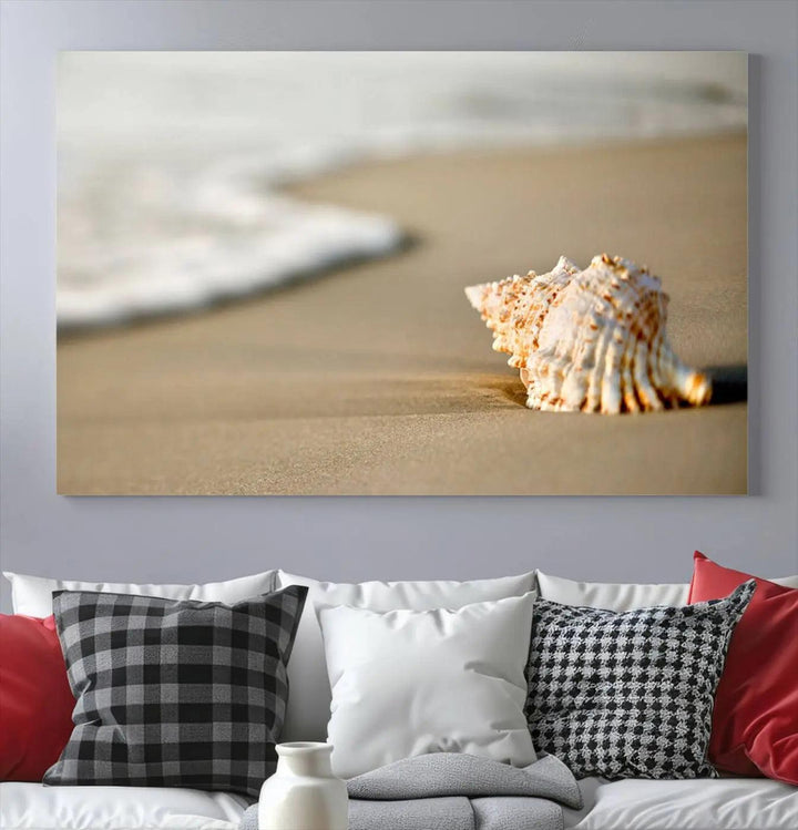 The triptych artwork titled "Sea Shell on the Beach Canvas Wall Art Beach Canvas Print" showcases a seashell on a sandy beach with ocean waves in the background, creating a stunning piece of coastal wall decor.