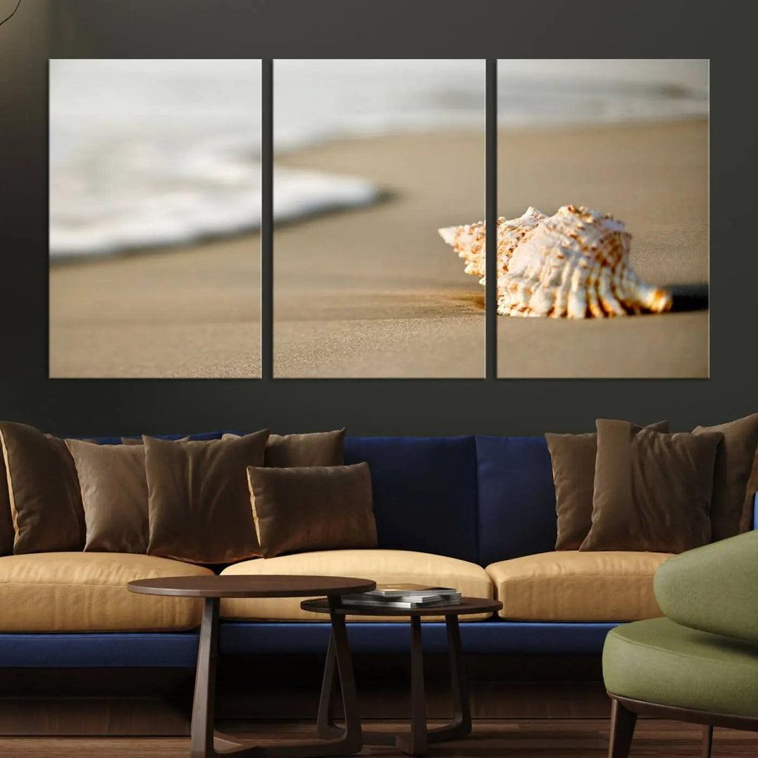 The triptych artwork titled "Sea Shell on the Beach Canvas Wall Art Beach Canvas Print" showcases a seashell on a sandy beach with ocean waves in the background, creating a stunning piece of coastal wall decor.