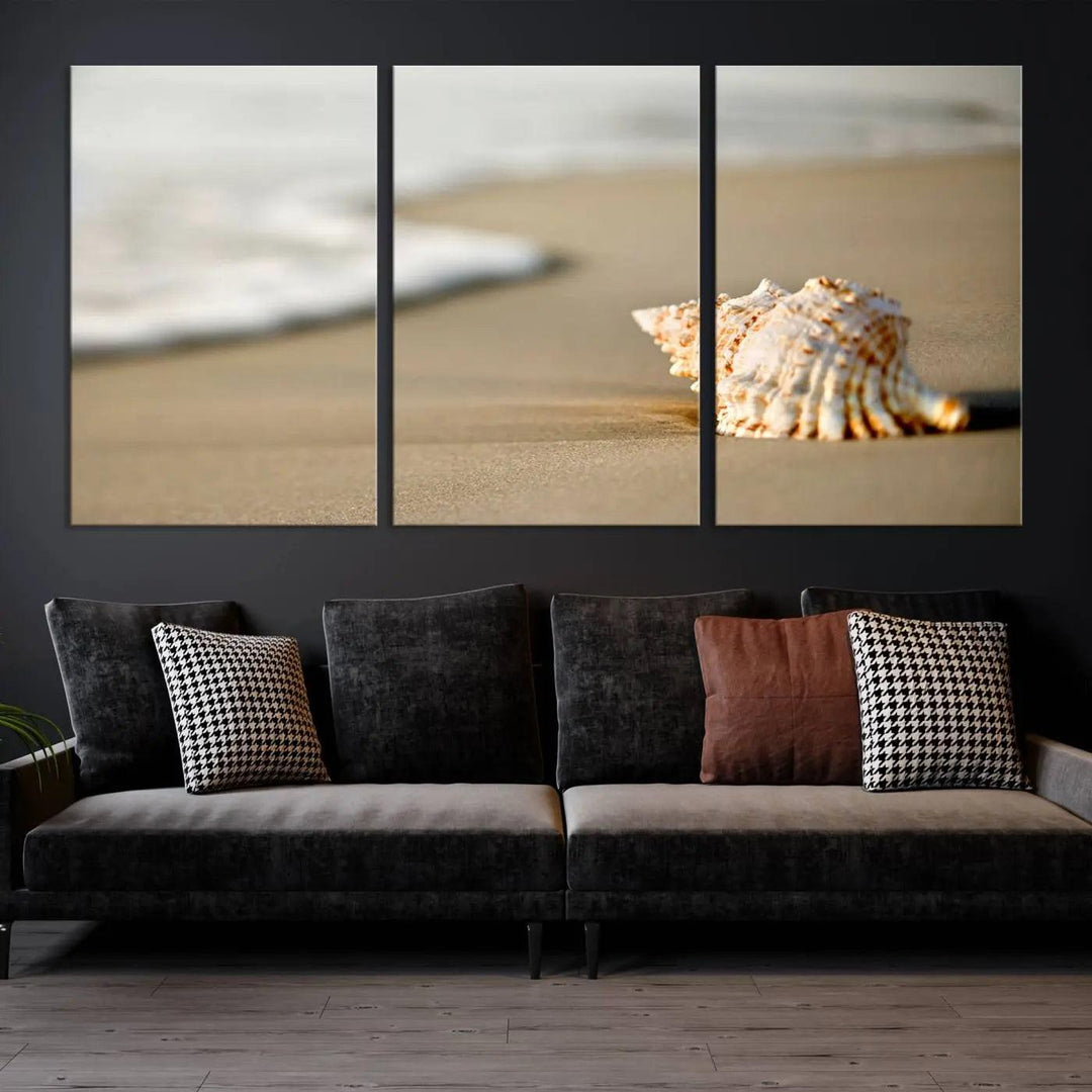 The triptych artwork titled "Sea Shell on the Beach Canvas Wall Art Beach Canvas Print" showcases a seashell on a sandy beach with ocean waves in the background, creating a stunning piece of coastal wall decor.