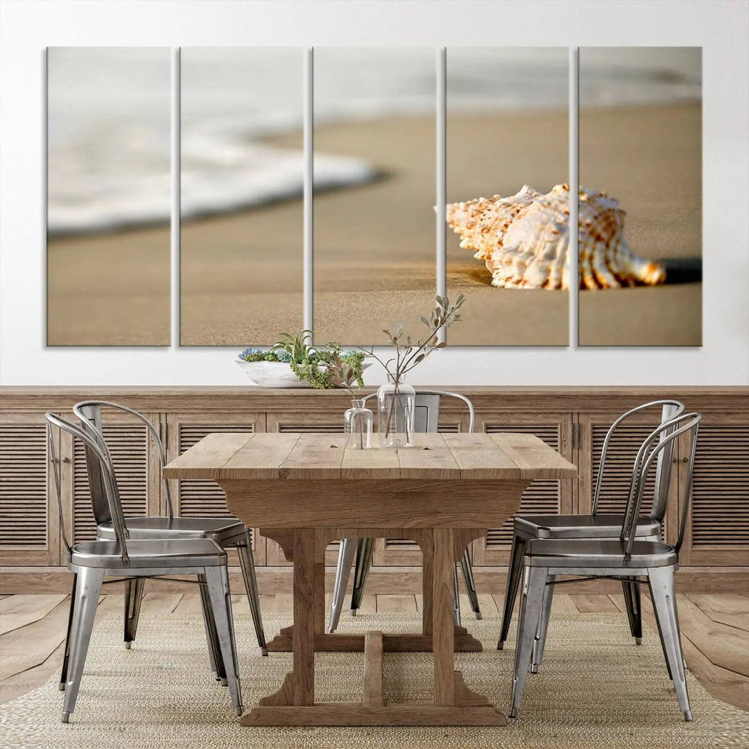 The triptych artwork titled "Sea Shell on the Beach Canvas Wall Art Beach Canvas Print" showcases a seashell on a sandy beach with ocean waves in the background, creating a stunning piece of coastal wall decor.