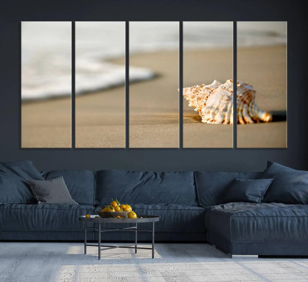 The triptych artwork titled "Sea Shell on the Beach Canvas Wall Art Beach Canvas Print" showcases a seashell on a sandy beach with ocean waves in the background, creating a stunning piece of coastal wall decor.