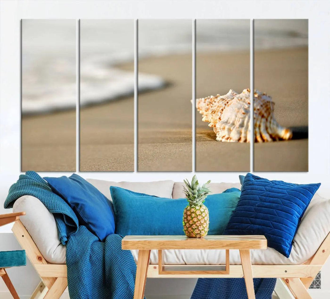 The triptych artwork titled "Sea Shell on the Beach Canvas Wall Art Beach Canvas Print" showcases a seashell on a sandy beach with ocean waves in the background, creating a stunning piece of coastal wall decor.