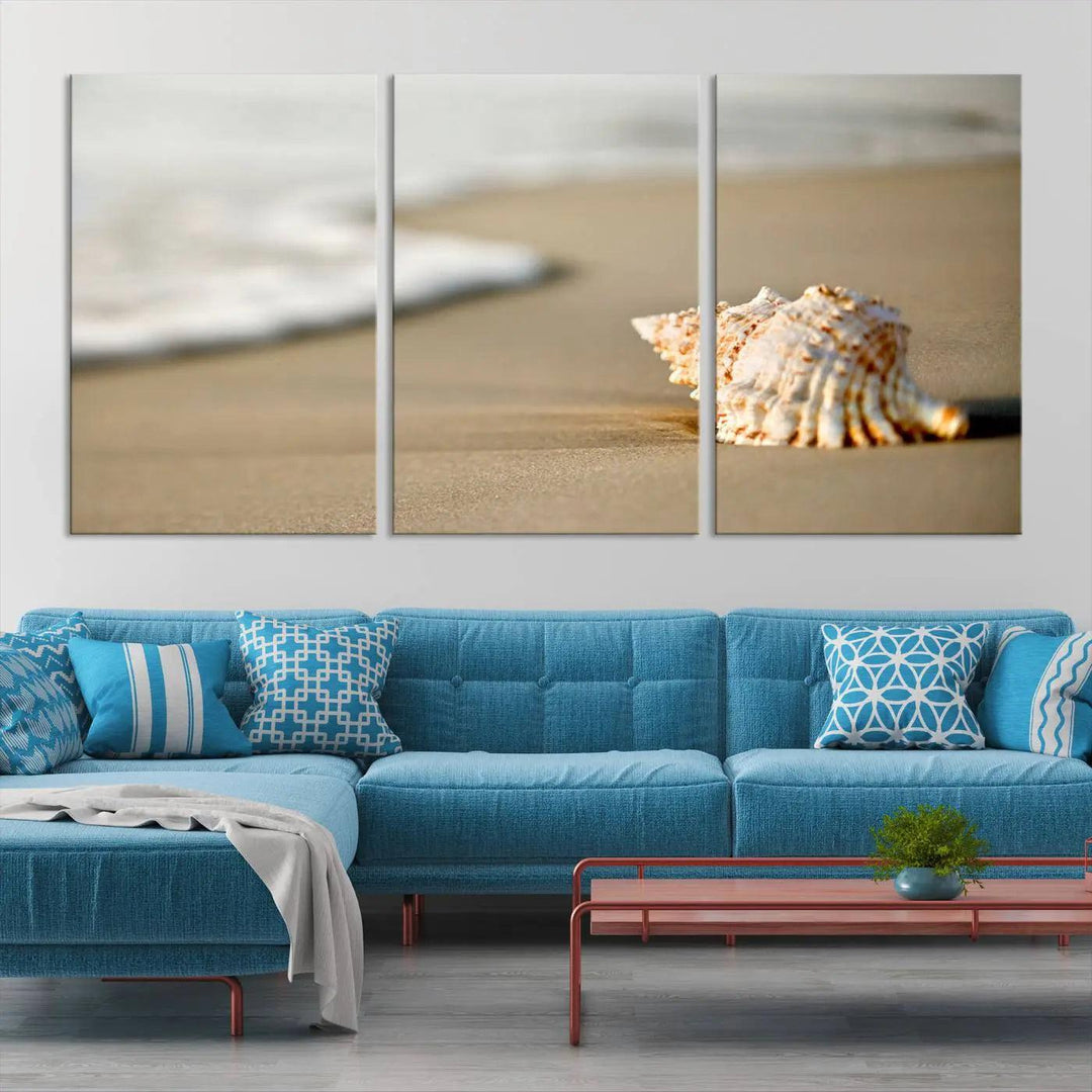 The triptych artwork titled "Sea Shell on the Beach Canvas Wall Art Beach Canvas Print" showcases a seashell on a sandy beach with ocean waves in the background, creating a stunning piece of coastal wall decor.