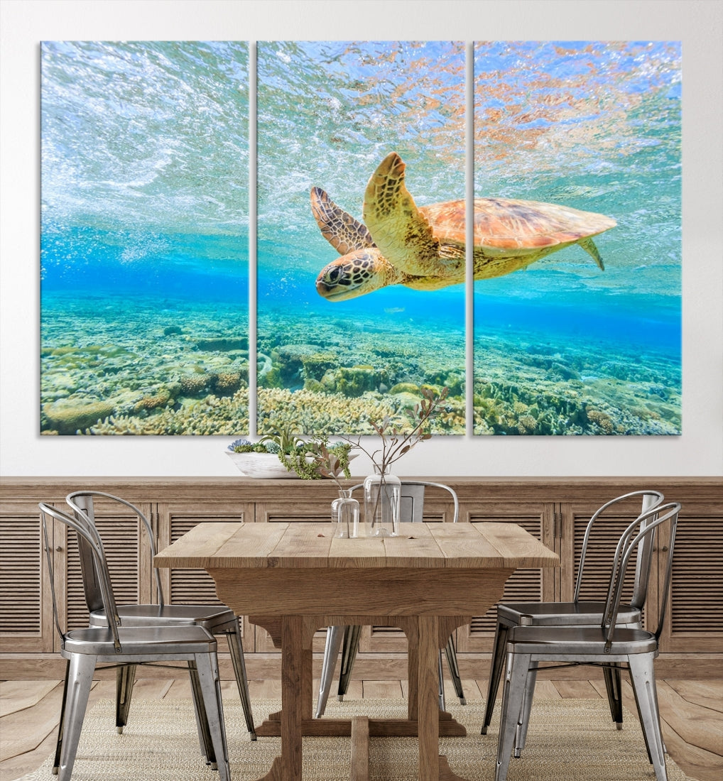 The "Sea Turtle Wall Art Canvas Print" features an enchanting scene of a sea turtle swimming underwater over coral. Crafted on museum-quality canvas with a UV-protective coating, this piece combines elegance and durability. Enjoy free shipping with your purchase.