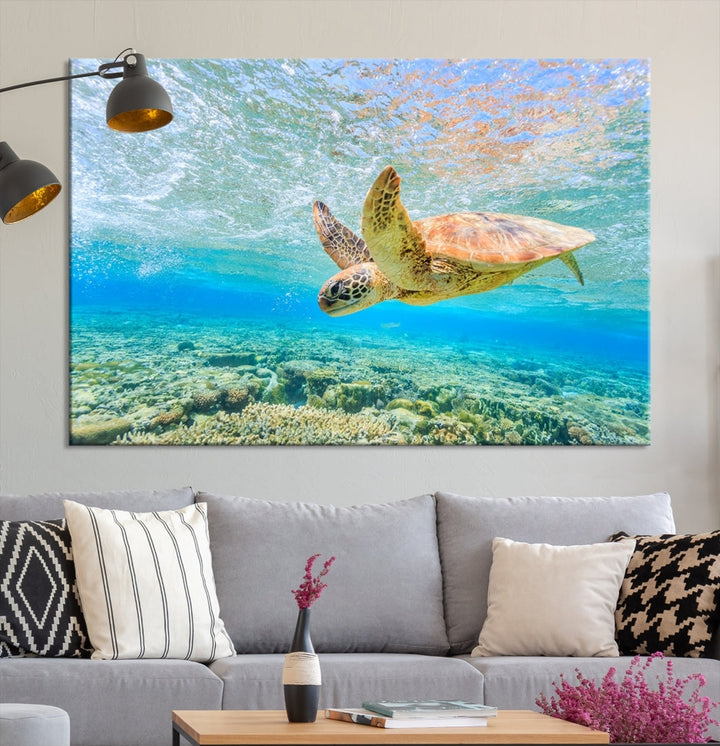 The "Sea Turtle Wall Art Canvas Print" features an enchanting scene of a sea turtle swimming underwater over coral. Crafted on museum-quality canvas with a UV-protective coating, this piece combines elegance and durability. Enjoy free shipping with your purchase.