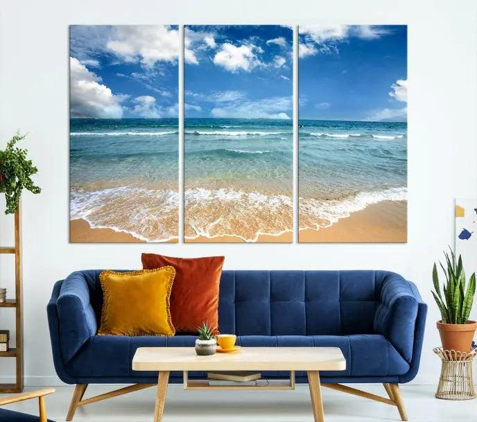 The "Sea View From the Beach Canvas Print" triptych adorns the wall. Each piece is printed on museum-quality canvas, ready to hang, and designed to preserve its vibrant colors with a UV-protective coating.