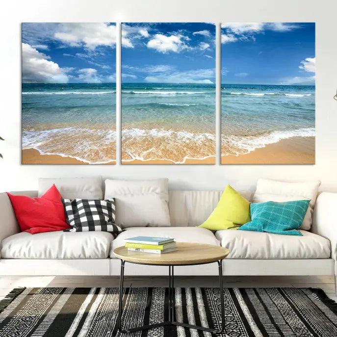 The "Sea View From the Beach Canvas Print" triptych adorns the wall. Each piece is printed on museum-quality canvas, ready to hang, and designed to preserve its vibrant colors with a UV-protective coating.