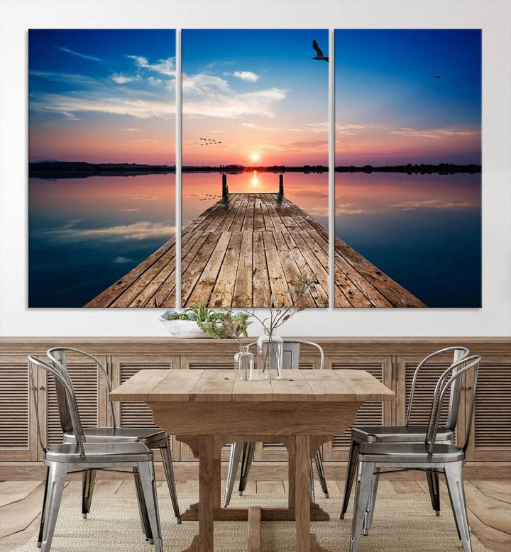 A Sea Wooden Pier Canvas Wall Art, featuring a sunset artwork print of the beach, fosters a coastal ambiance in the modern living room.