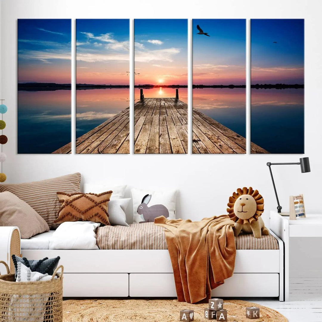 A Sea Wooden Pier Canvas Wall Art, featuring a sunset artwork print of the beach, fosters a coastal ambiance in the modern living room.