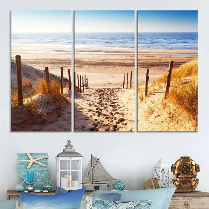 A triptych of Serene Beach Path Canvas Art, a giclee canvas print with gallery wrap, adorns the wall. This stunning coastal sand dunes wall art, crafted with Canon print quality, adds a tranquil touch to the space.