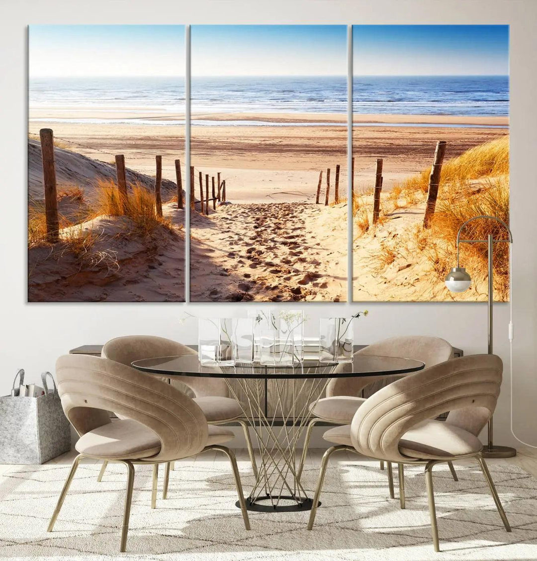 A triptych of Serene Beach Path Canvas Art, a giclee canvas print with gallery wrap, adorns the wall. This stunning coastal sand dunes wall art, crafted with Canon print quality, adds a tranquil touch to the space.