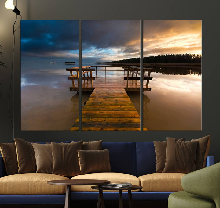 The Serene Lake Pier at Sunset canvas print depicts a wooden dock extending into a tranquil lake.