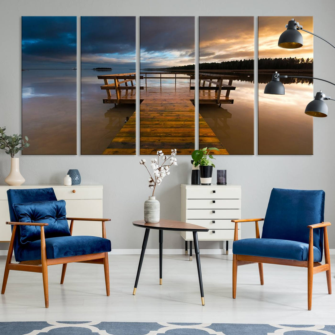 The Serene Lake Pier at Sunset canvas print depicts a wooden dock extending into a tranquil lake.