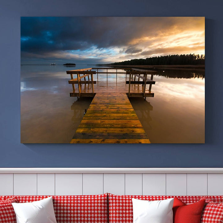 The Serene Lake Pier at Sunset canvas print depicts a wooden dock extending into a tranquil lake.