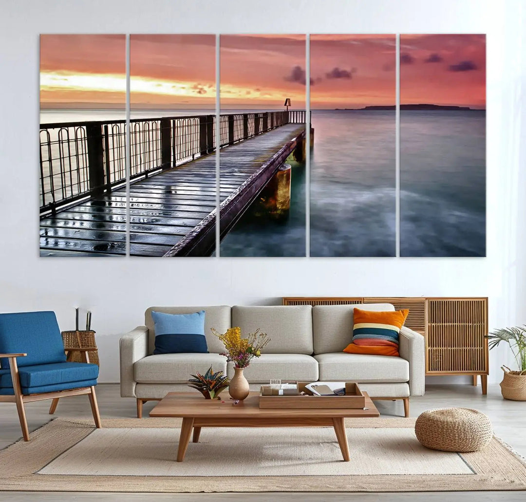 This living room is decorated in a soothing coastal style, featuring the "Serene Pier at Sunset" canvas print wall art.