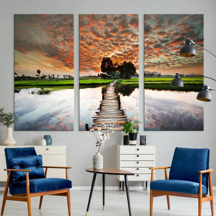 Serene sunset wooden bridge triptych canvas art. Giclee print with vibrant sunset reflections, perfect for tranquil and scenic spaces.