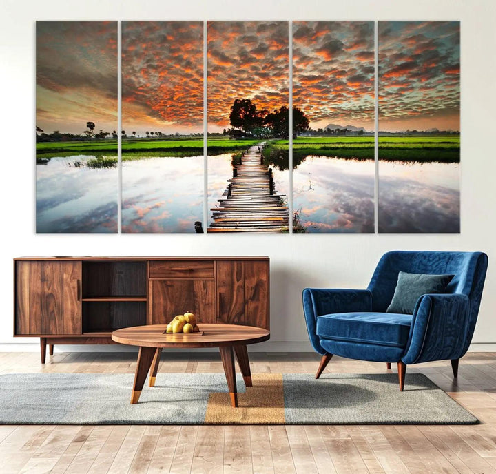 Serene sunset wooden bridge triptych canvas art. Giclee print with vibrant sunset reflections, perfect for tranquil and scenic spaces.