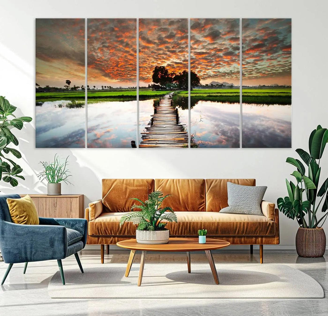 Serene sunset wooden bridge triptych canvas art. Giclee print with vibrant sunset reflections, perfect for tranquil and scenic spaces.