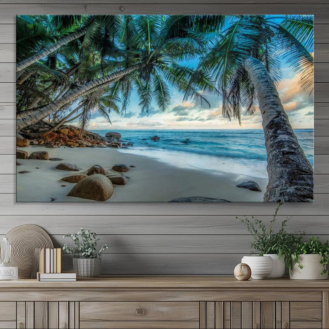 The Serene Tropical Beach Palm Trees Wall Art Canvas Print—a Coastal Paradise 3-Panel Artwork featuring ocean waves—enhances the space with its Giclee technology print.