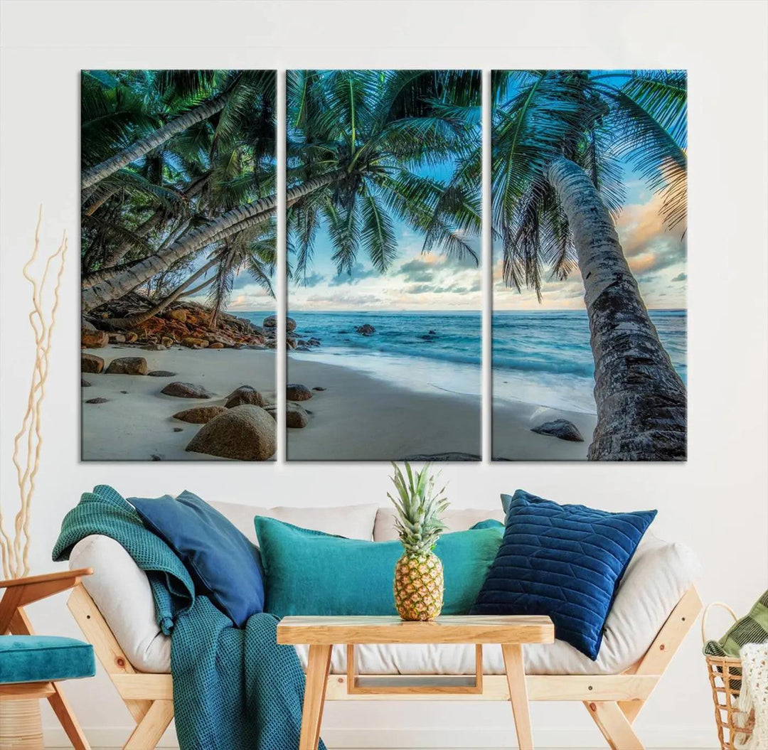 The Serene Tropical Beach Palm Trees Wall Art Canvas Print—a Coastal Paradise 3-Panel Artwork featuring ocean waves—enhances the space with its Giclee technology print.