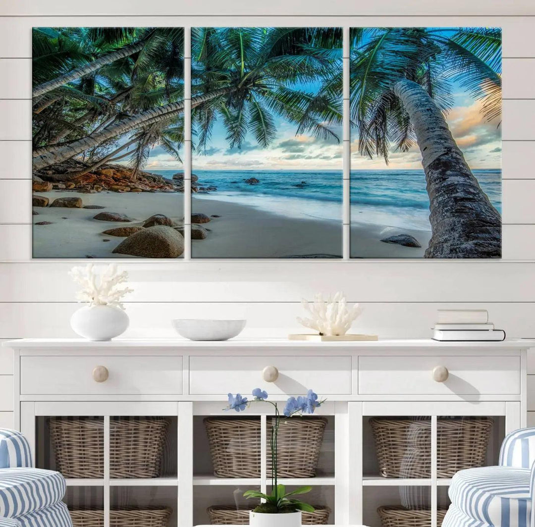 The Serene Tropical Beach Palm Trees Wall Art Canvas Print—a Coastal Paradise 3-Panel Artwork featuring ocean waves—enhances the space with its Giclee technology print.