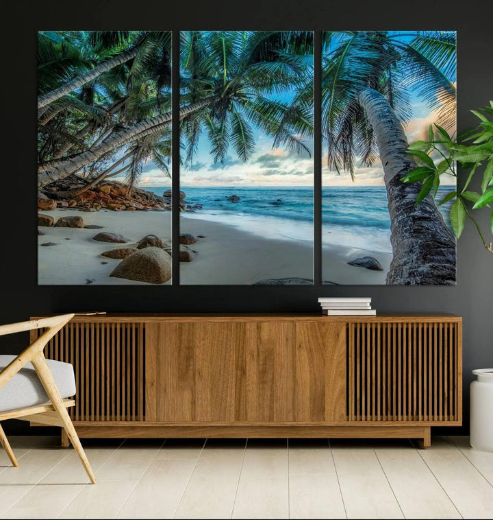 The Serene Tropical Beach Palm Trees Wall Art Canvas Print—a Coastal Paradise 3-Panel Artwork featuring ocean waves—enhances the space with its Giclee technology print.