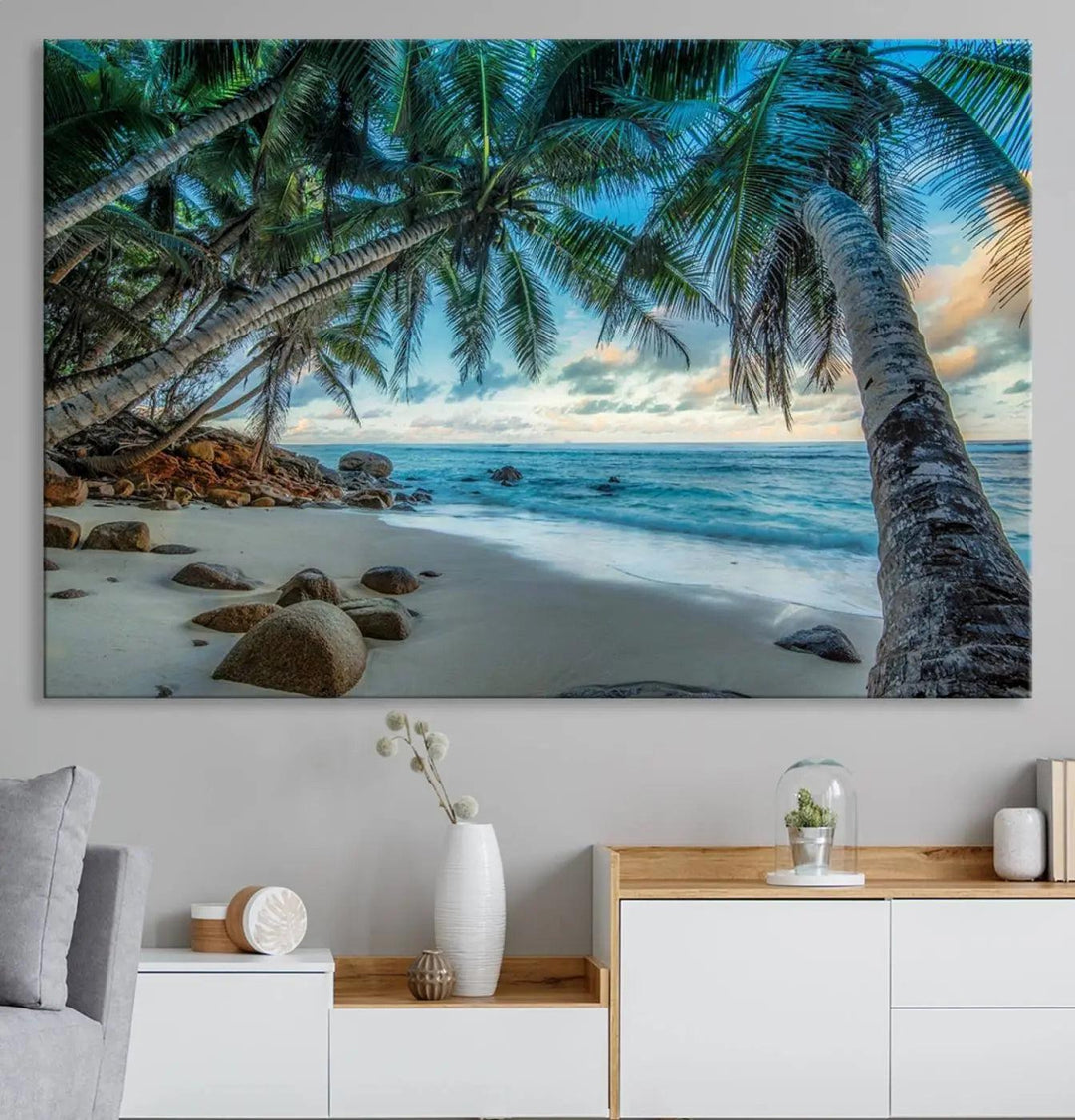 The Serene Tropical Beach Palm Trees Wall Art Canvas Print—a Coastal Paradise 3-Panel Artwork featuring ocean waves—enhances the space with its Giclee technology print.