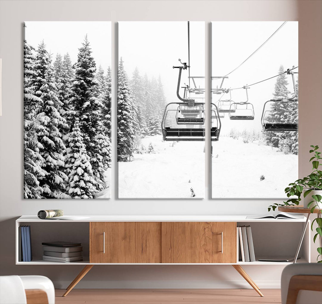 The Ski Wall Art, featuring the "Ski Lift Wall Art Canvas Print," presents a snowy scene with snow-covered spruce trees and is elegantly showcased on a dark green wall.