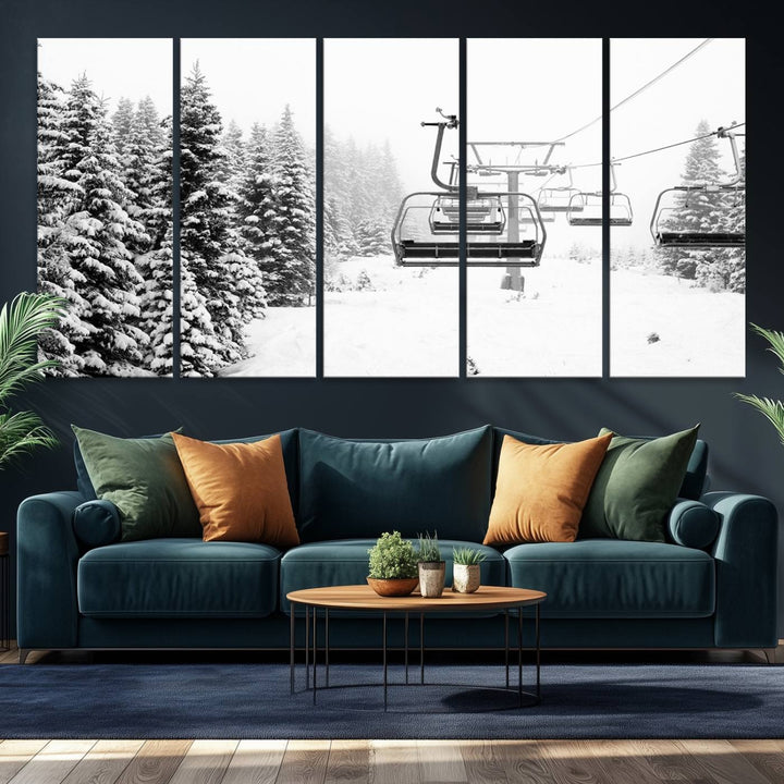 The Ski Wall Art, featuring the "Ski Lift Wall Art Canvas Print," presents a snowy scene with snow-covered spruce trees and is elegantly showcased on a dark green wall.