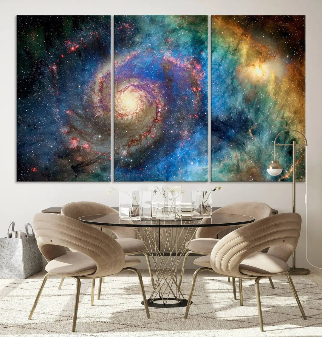 The living room showcases three colorful space-themed paintings titled "Spiral Galaxy Wall Art Canvas Print" on the wall, featuring museum-quality craftsmanship with vibrant colors through high-resolution printing.