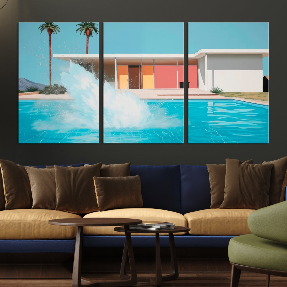 The "Splash in the Pool" Canvas Print Mid Century Wall Art features a triptych design of a pool splash in front of a mid-century modern house with palm trees. This museum-quality canvas, complete with a UV-protective coating and gallery-wrapped finish, is an ideal addition to any stylish living space.