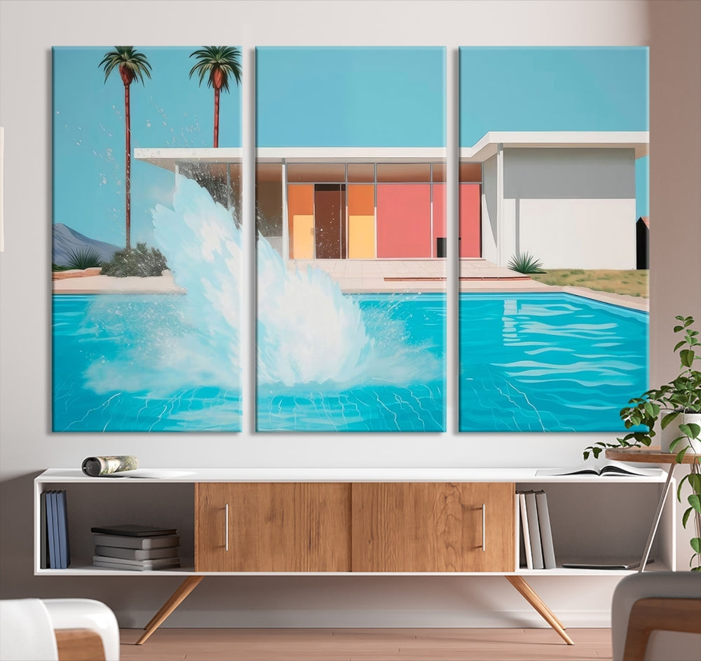 The "Splash in the Pool" Canvas Print Mid Century Wall Art features a triptych design of a pool splash in front of a mid-century modern house with palm trees. This museum-quality canvas, complete with a UV-protective coating and gallery-wrapped finish, is an ideal addition to any stylish living space.