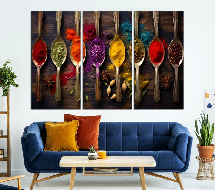 The Sponge Kitchen Wall Art Canvas Print showcases decorative artwork featuring spoons filled with colorful spices against a wooden background. Printed on museum-quality canvas, this ready-to-hang piece effortlessly adds charm and vibrancy to any space.