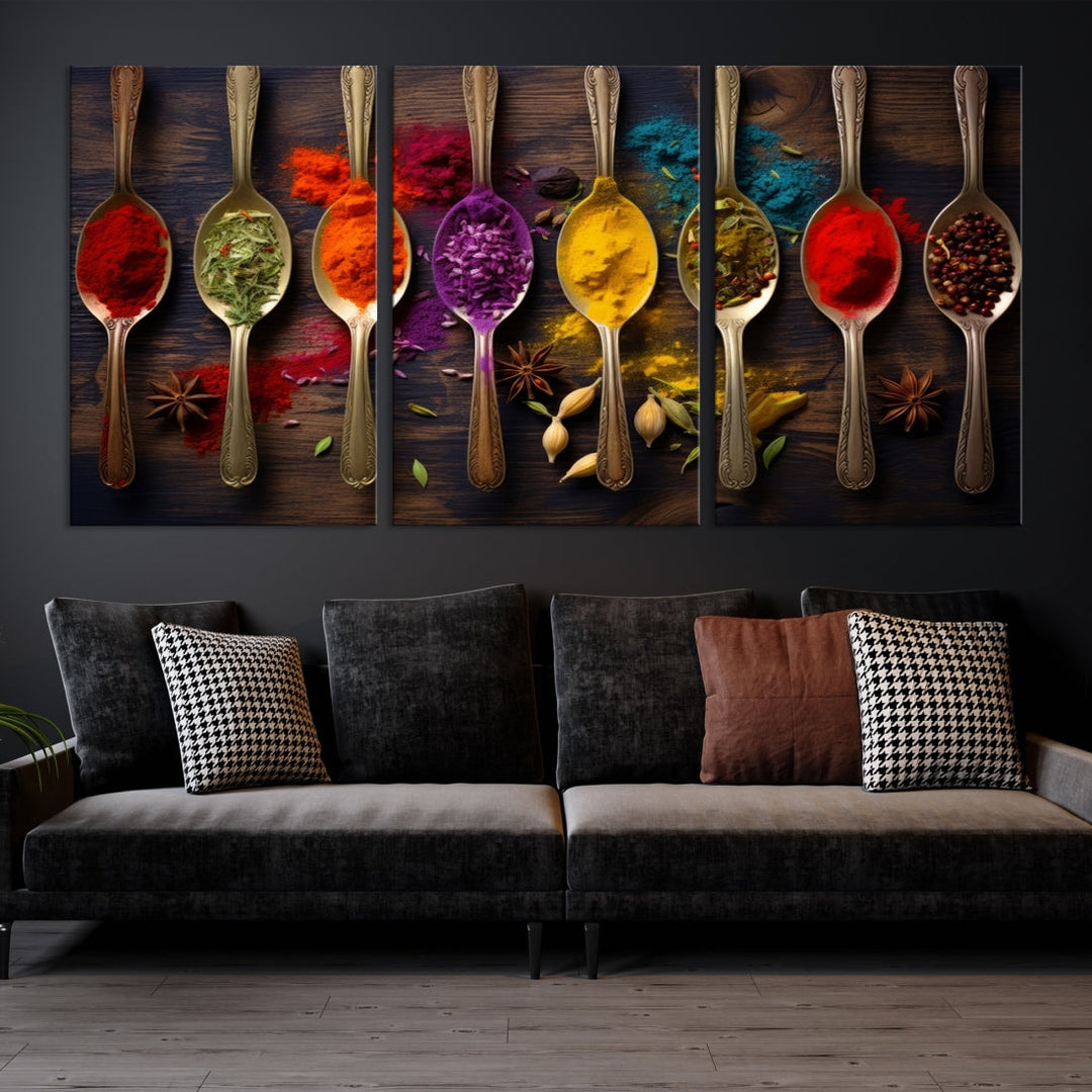 The Sponge Kitchen Wall Art Canvas Print showcases decorative artwork featuring spoons filled with colorful spices against a wooden background. Printed on museum-quality canvas, this ready-to-hang piece effortlessly adds charm and vibrancy to any space.