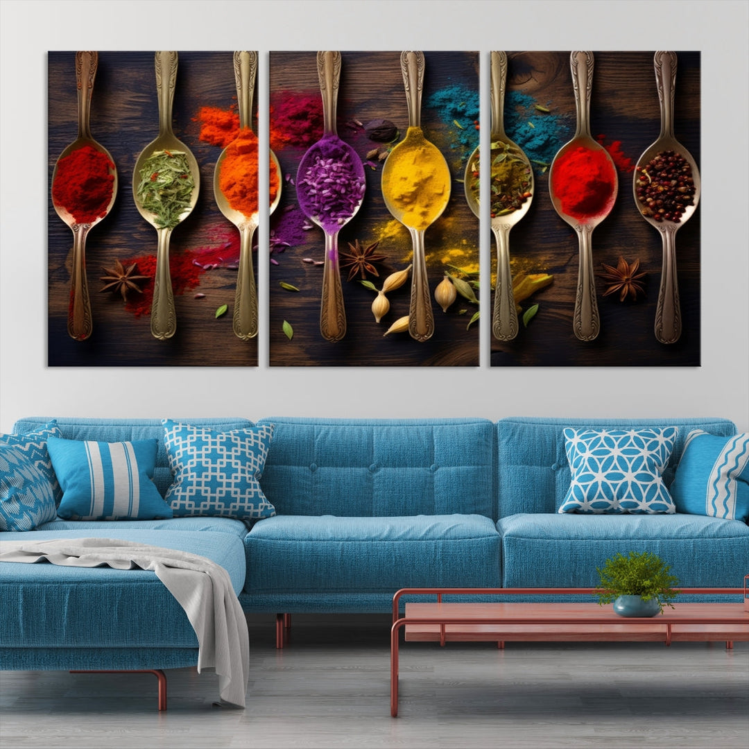 The Sponge Kitchen Wall Art Canvas Print showcases decorative artwork featuring spoons filled with colorful spices against a wooden background. Printed on museum-quality canvas, this ready-to-hang piece effortlessly adds charm and vibrancy to any space.