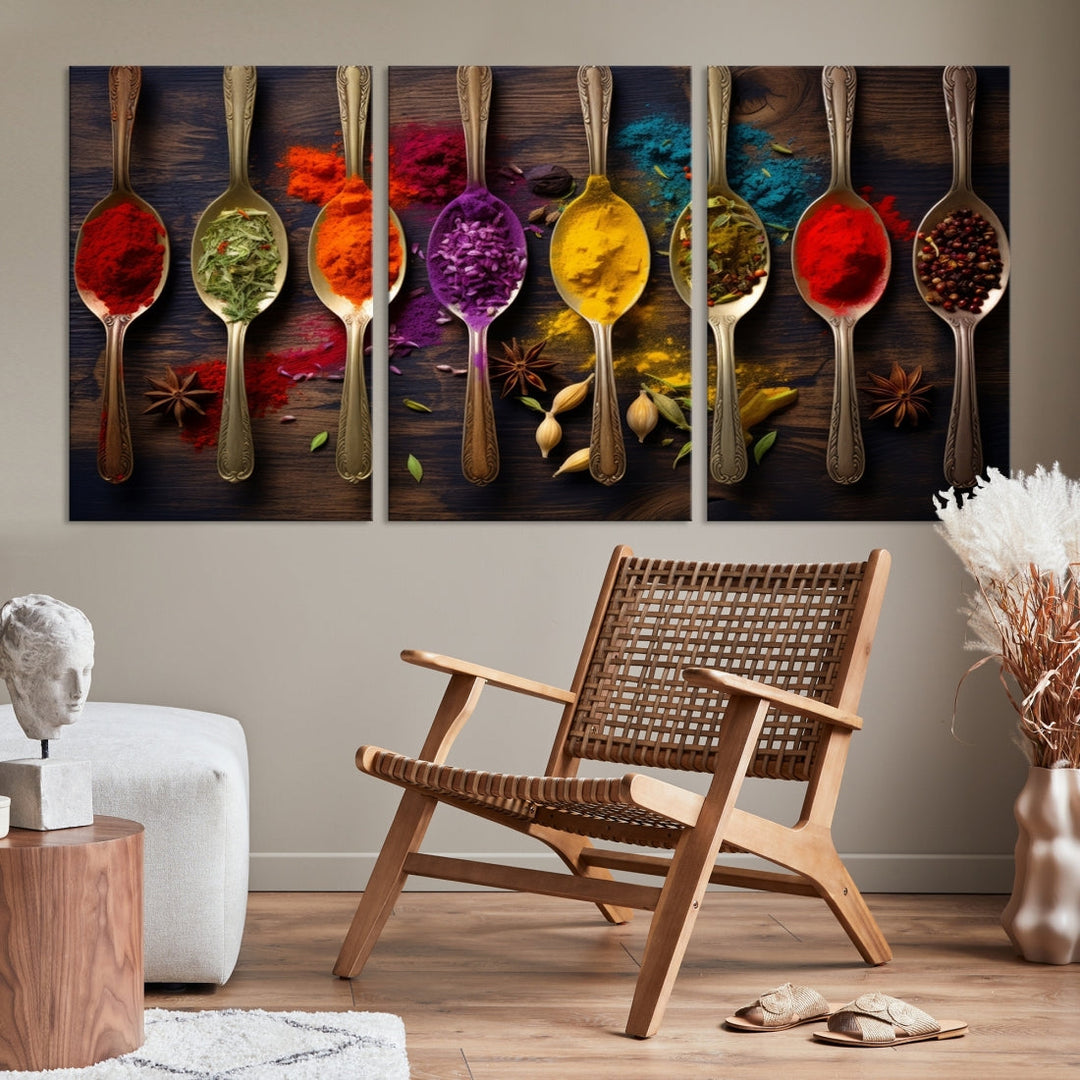 The Sponge Kitchen Wall Art Canvas Print showcases decorative artwork featuring spoons filled with colorful spices against a wooden background. Printed on museum-quality canvas, this ready-to-hang piece effortlessly adds charm and vibrancy to any space.