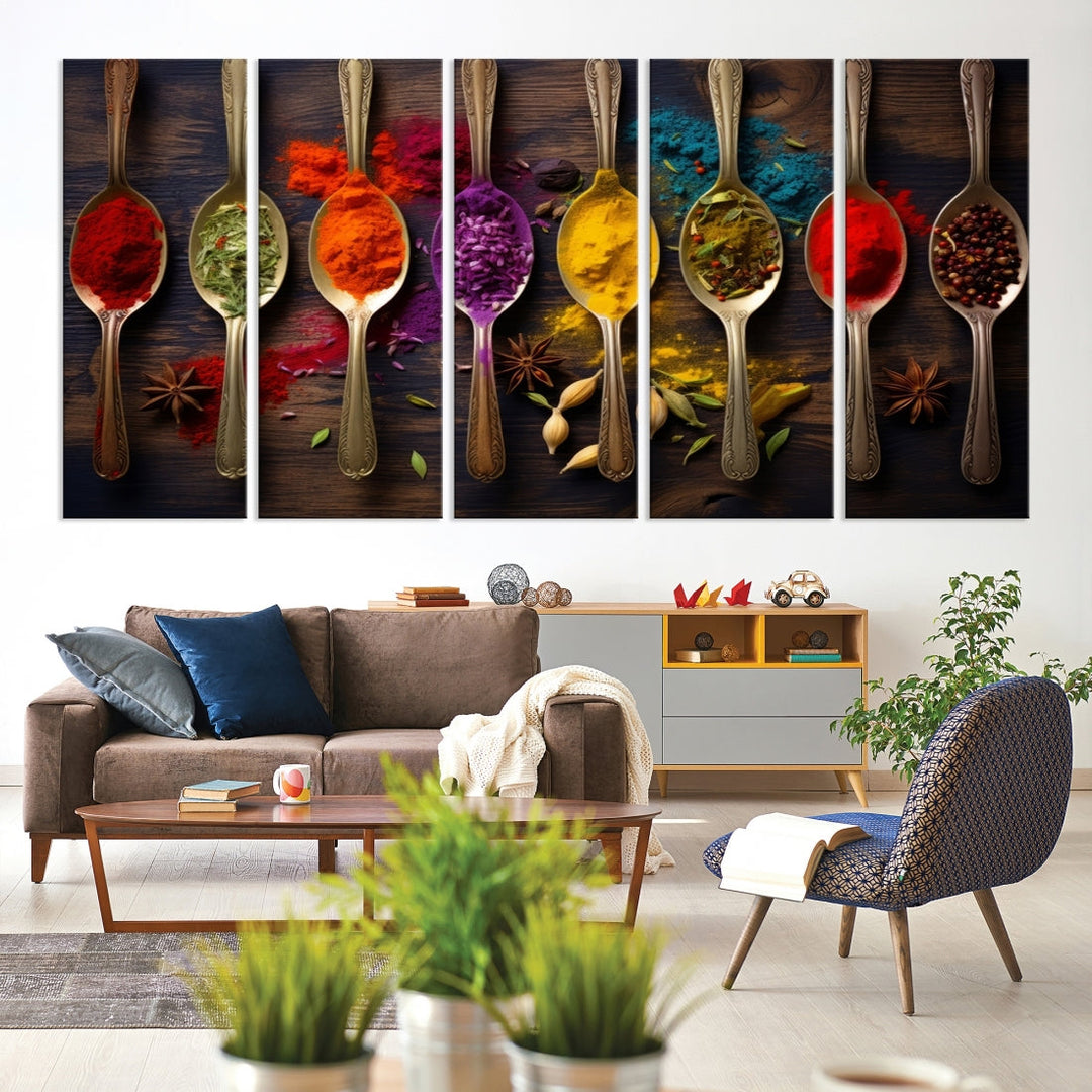 The Sponge Kitchen Wall Art Canvas Print showcases decorative artwork featuring spoons filled with colorful spices against a wooden background. Printed on museum-quality canvas, this ready-to-hang piece effortlessly adds charm and vibrancy to any space.