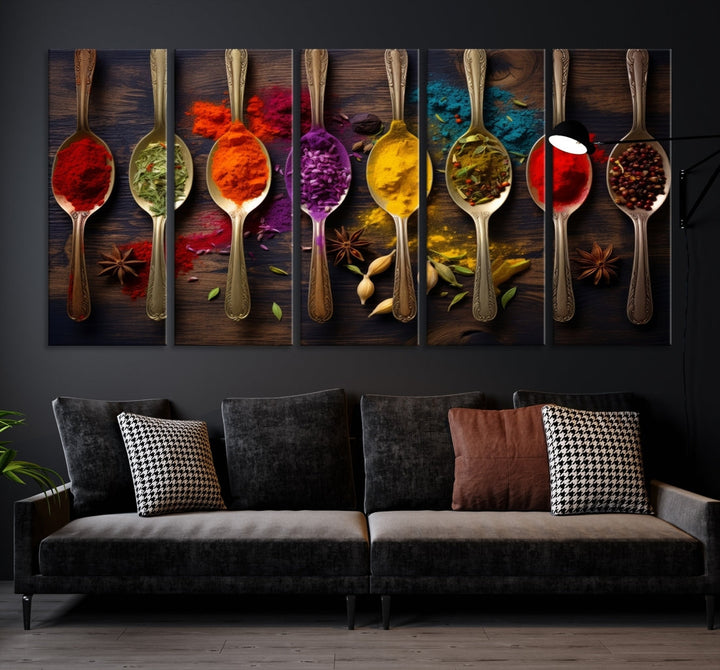 The Sponge Kitchen Wall Art Canvas Print showcases decorative artwork featuring spoons filled with colorful spices against a wooden background. Printed on museum-quality canvas, this ready-to-hang piece effortlessly adds charm and vibrancy to any space.