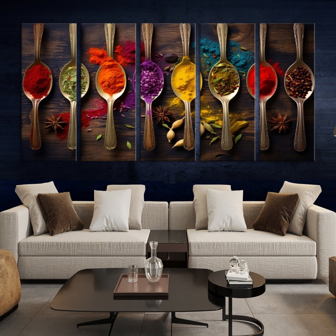 The Sponge Kitchen Wall Art Canvas Print showcases decorative artwork featuring spoons filled with colorful spices against a wooden background. Printed on museum-quality canvas, this ready-to-hang piece effortlessly adds charm and vibrancy to any space.