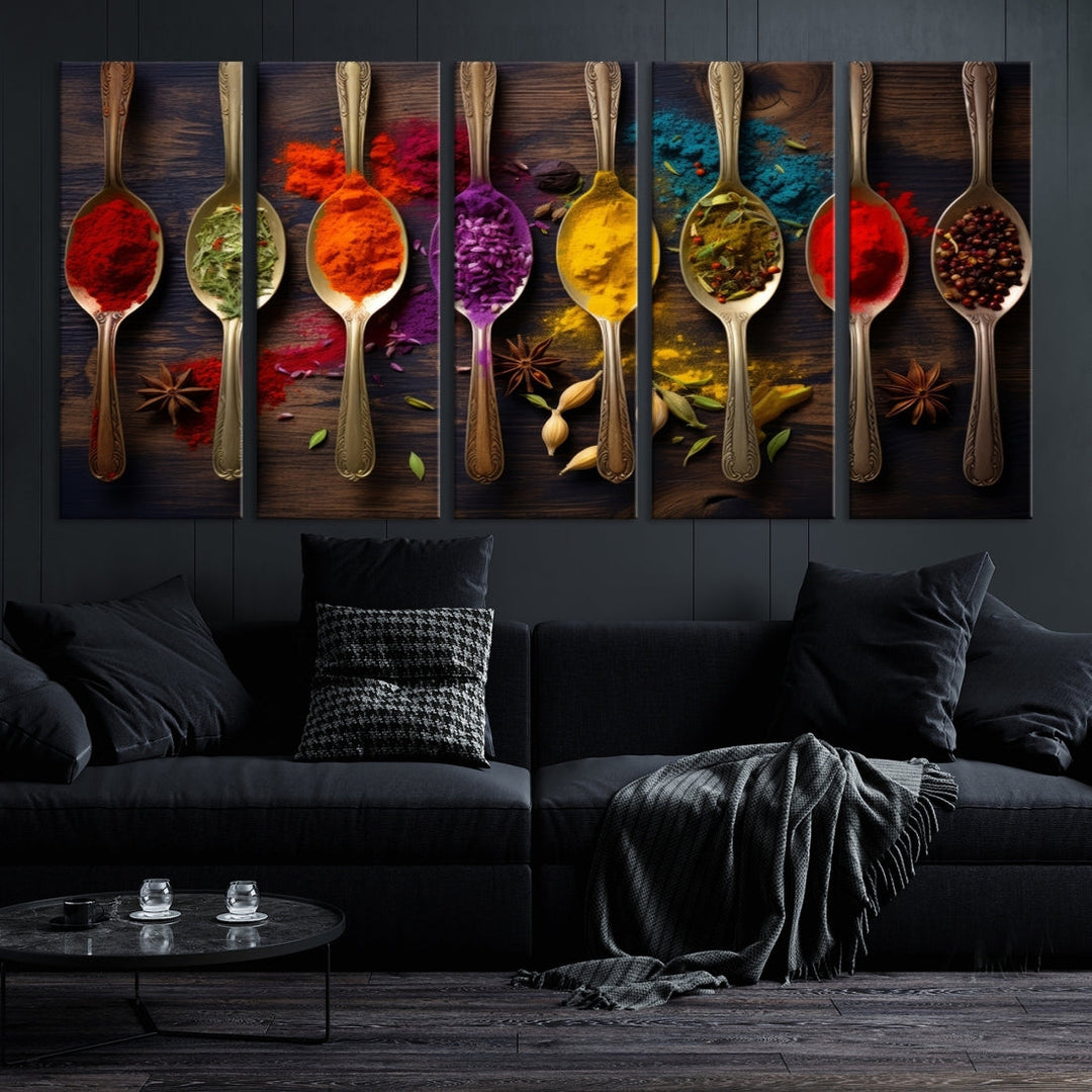 The Sponge Kitchen Wall Art Canvas Print showcases decorative artwork featuring spoons filled with colorful spices against a wooden background. Printed on museum-quality canvas, this ready-to-hang piece effortlessly adds charm and vibrancy to any space.