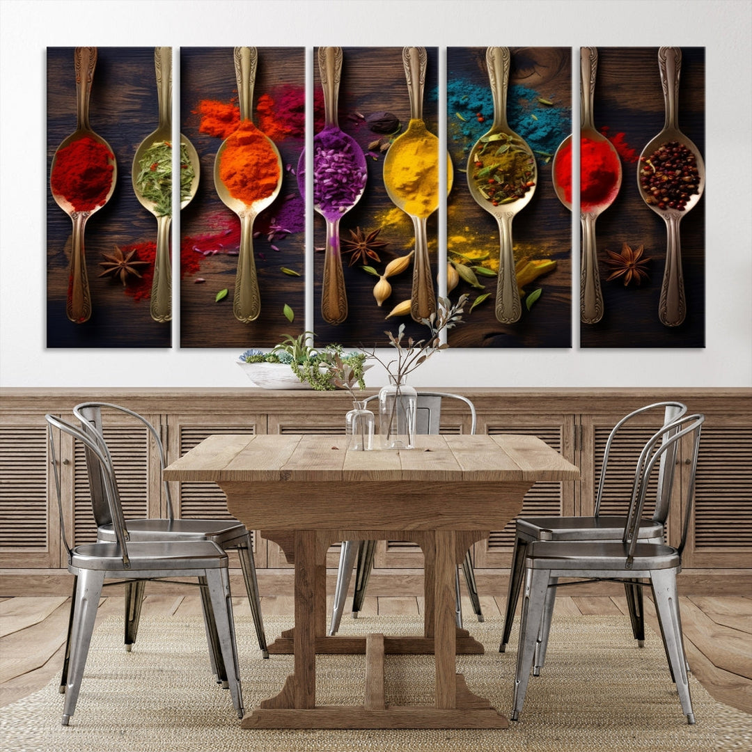 The Sponge Kitchen Wall Art Canvas Print showcases decorative artwork featuring spoons filled with colorful spices against a wooden background. Printed on museum-quality canvas, this ready-to-hang piece effortlessly adds charm and vibrancy to any space.