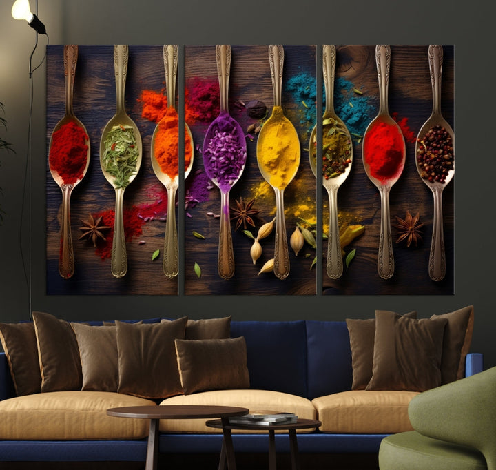 The Sponge Kitchen Wall Art Canvas Print showcases decorative artwork featuring spoons filled with colorful spices against a wooden background. Printed on museum-quality canvas, this ready-to-hang piece effortlessly adds charm and vibrancy to any space.