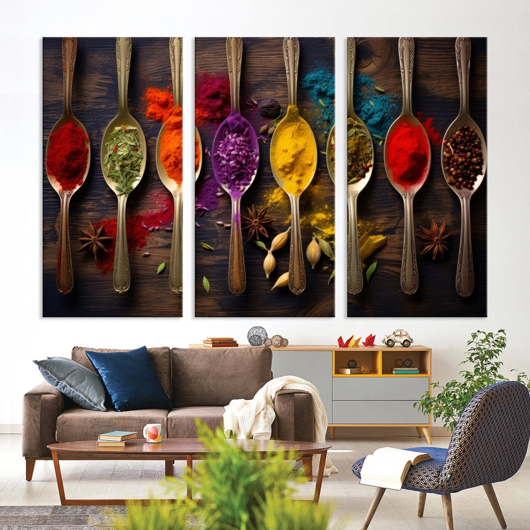 The Sponge Kitchen Wall Art Canvas Print showcases decorative artwork featuring spoons filled with colorful spices against a wooden background. Printed on museum-quality canvas, this ready-to-hang piece effortlessly adds charm and vibrancy to any space.