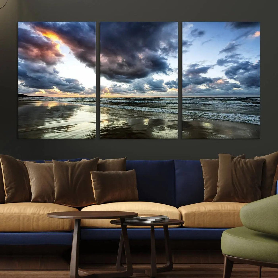 A breathtaking "Stormy Ocean Sky Wall Art" canvas print beautifully depicts stormy ocean skies and waves at sunset, with reflections shimmering on wet sand.