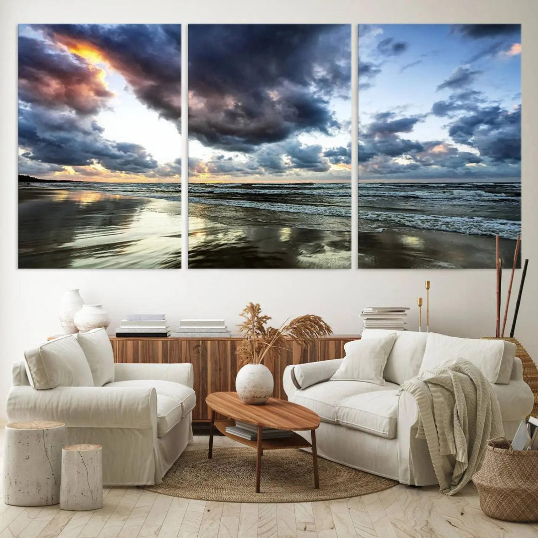 A breathtaking "Stormy Ocean Sky Wall Art" canvas print beautifully depicts stormy ocean skies and waves at sunset, with reflections shimmering on wet sand.