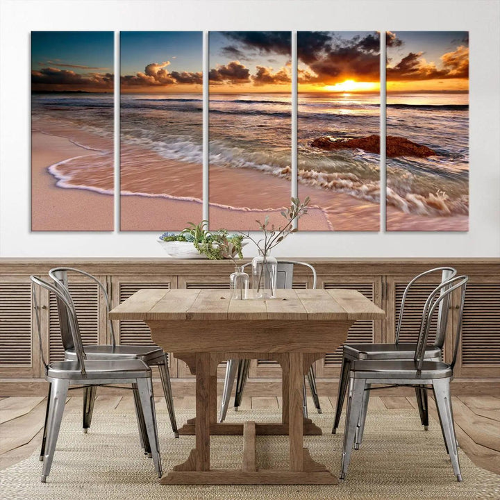 The Sunset Beach Waves Triptych Wall Art, featuring a tropical ocean scene on giclee canvas with a gallery wrap, adorns the wall in a cozy, coastal-themed living room.