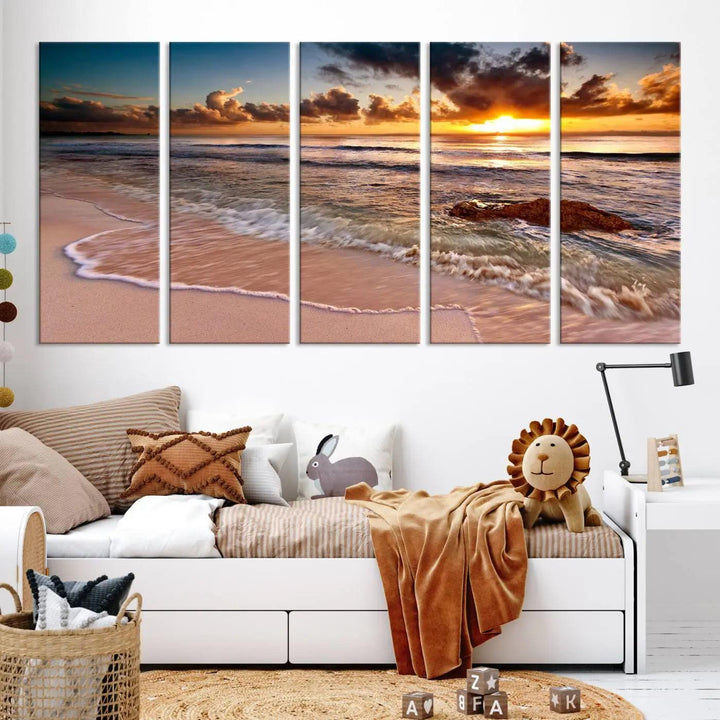 The Sunset Beach Waves Triptych Wall Art, featuring a tropical ocean scene on giclee canvas with a gallery wrap, adorns the wall in a cozy, coastal-themed living room.