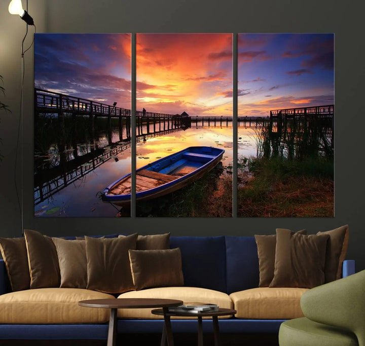 The "Sunset Boat Scene on Lake Triptych" beautifully captures a vibrant sunset over a calm lake. This tranquil scene, featuring serene reflections and surrounded by reeds, is printed on premium giclee canvas with Canon print quality. The gallery wrap design enhances every detail of tranquility.